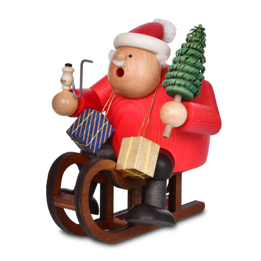 Rot gebeizter KWO Räuchermann Weihnachtsmann mit Schlitten aus der Serie Die Dicken (Art. 21530), handgefertigt im Erzgebirge, mit Geschenken, Tannenbaum und Pfeife.