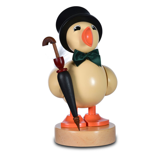 Gelbe KWO Osterküken-Holzfigur mit schwarzem Zylinder, grüner Fliege und schwarzem Schirm auf Holzsockel.